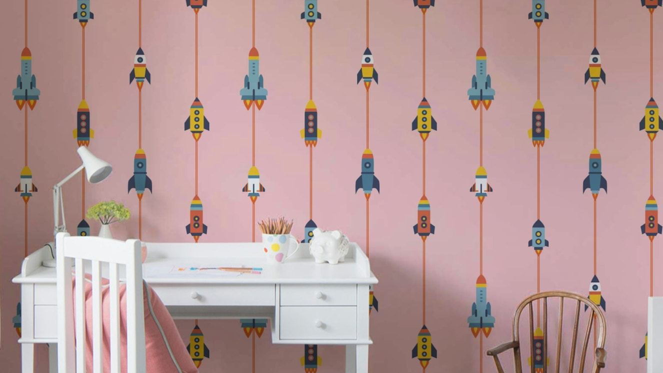 The image shows a repeating design with spaceships, rockets, and stars.

