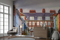 The wall art combines historical architecture with a modern city scene.

