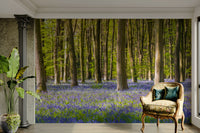 The mural shows a serene, tree-lined road.

