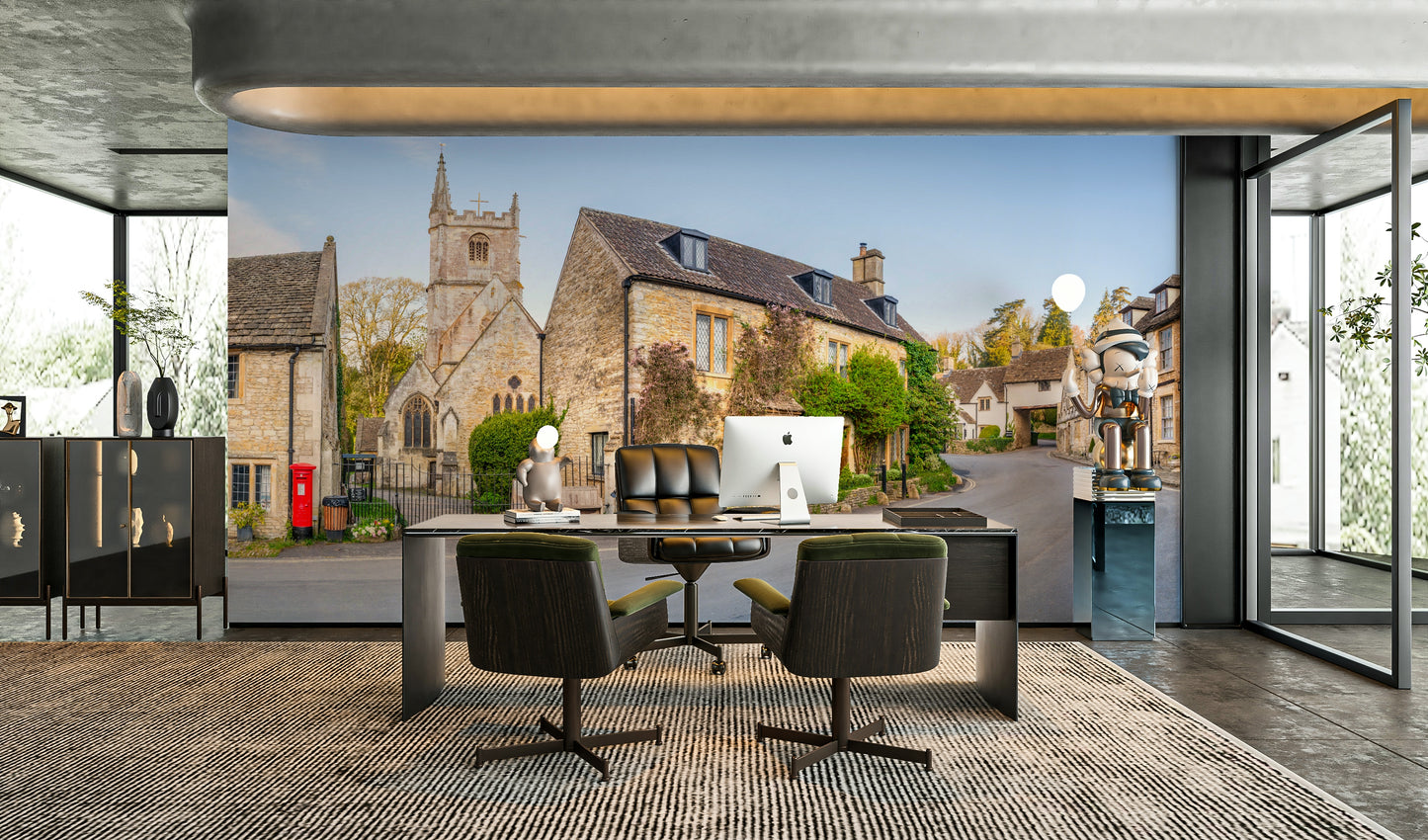 The mural shows a peaceful street scene with stone cottages.

