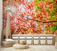 The mural shows a close-up of red and green foliage.

