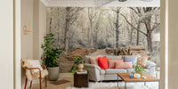 Wall mural of a woodland path with stacked logs.

