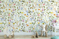 Wall mural with a watercolor wildflower meadow.

