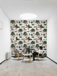 The scene is set in a green, scenic countryside.

