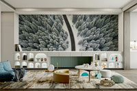 The mural features a forest landscape in winter.

