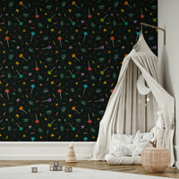 The design includes various festive motifs like planets, stars, and candy.
