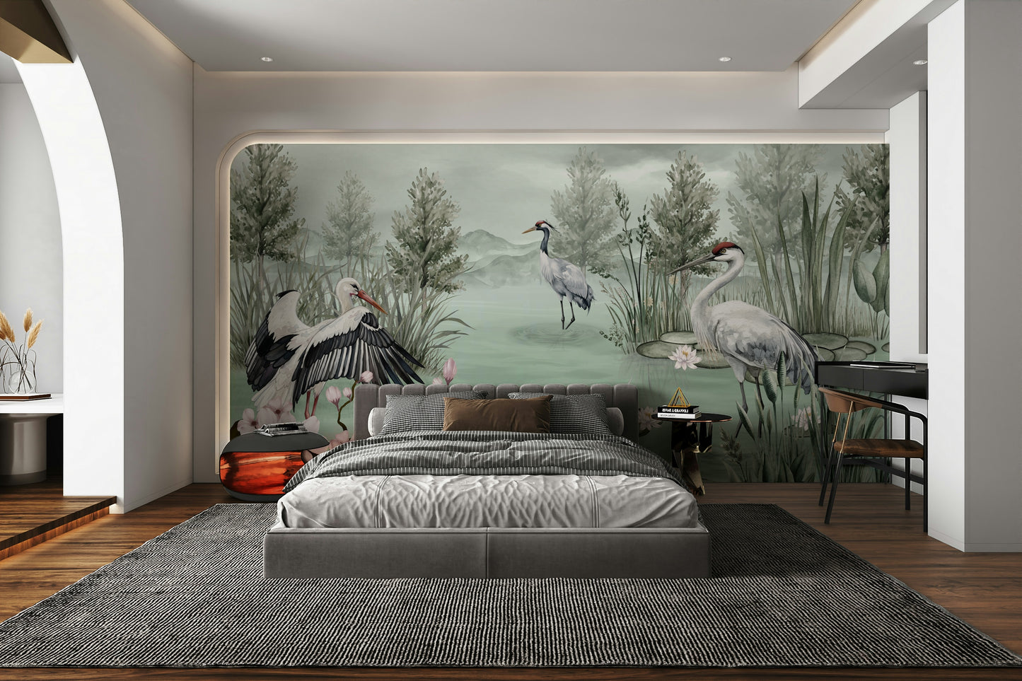 The design features graceful cranes near a calm body of water.

