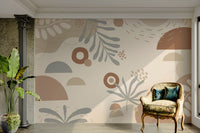 The design features stylized, neutral-colored leaves.

