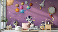 A peaceful wall mural with a whimsical, space-themed design.

