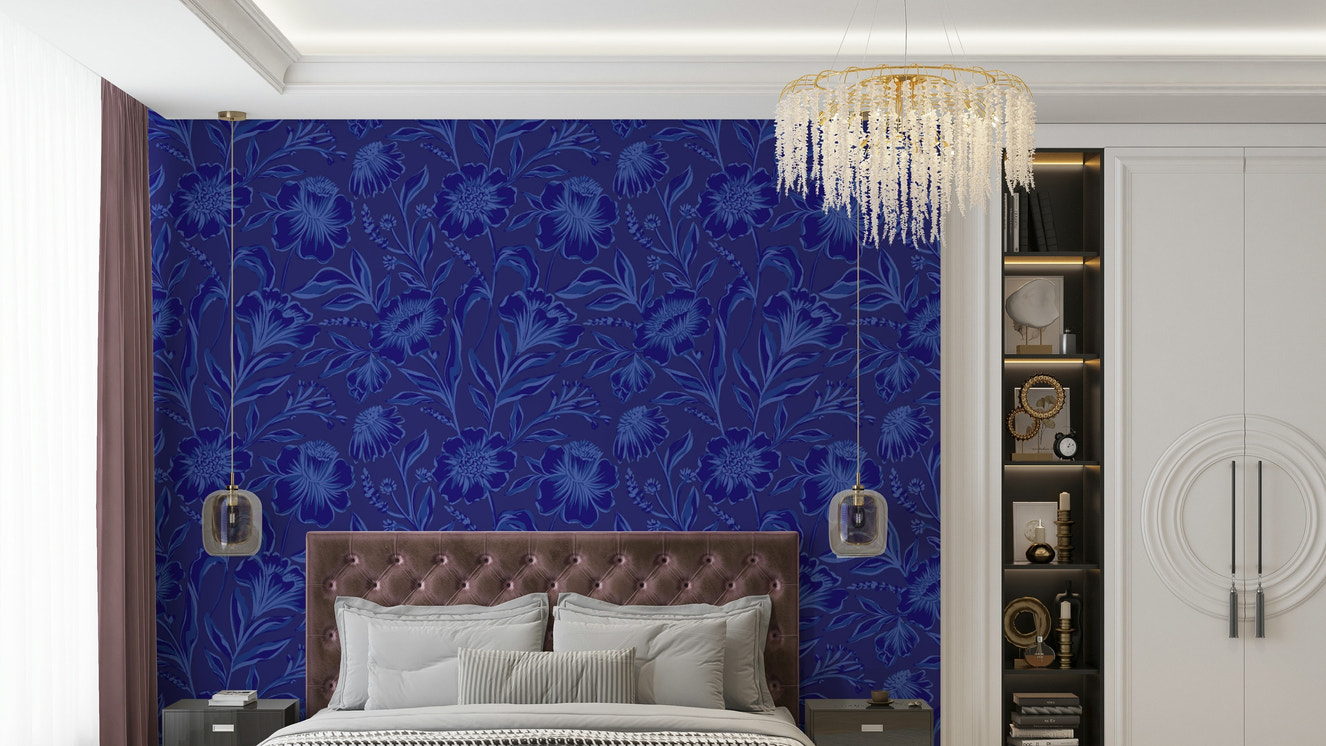 The image features large flowers and leaves on a dark background.
