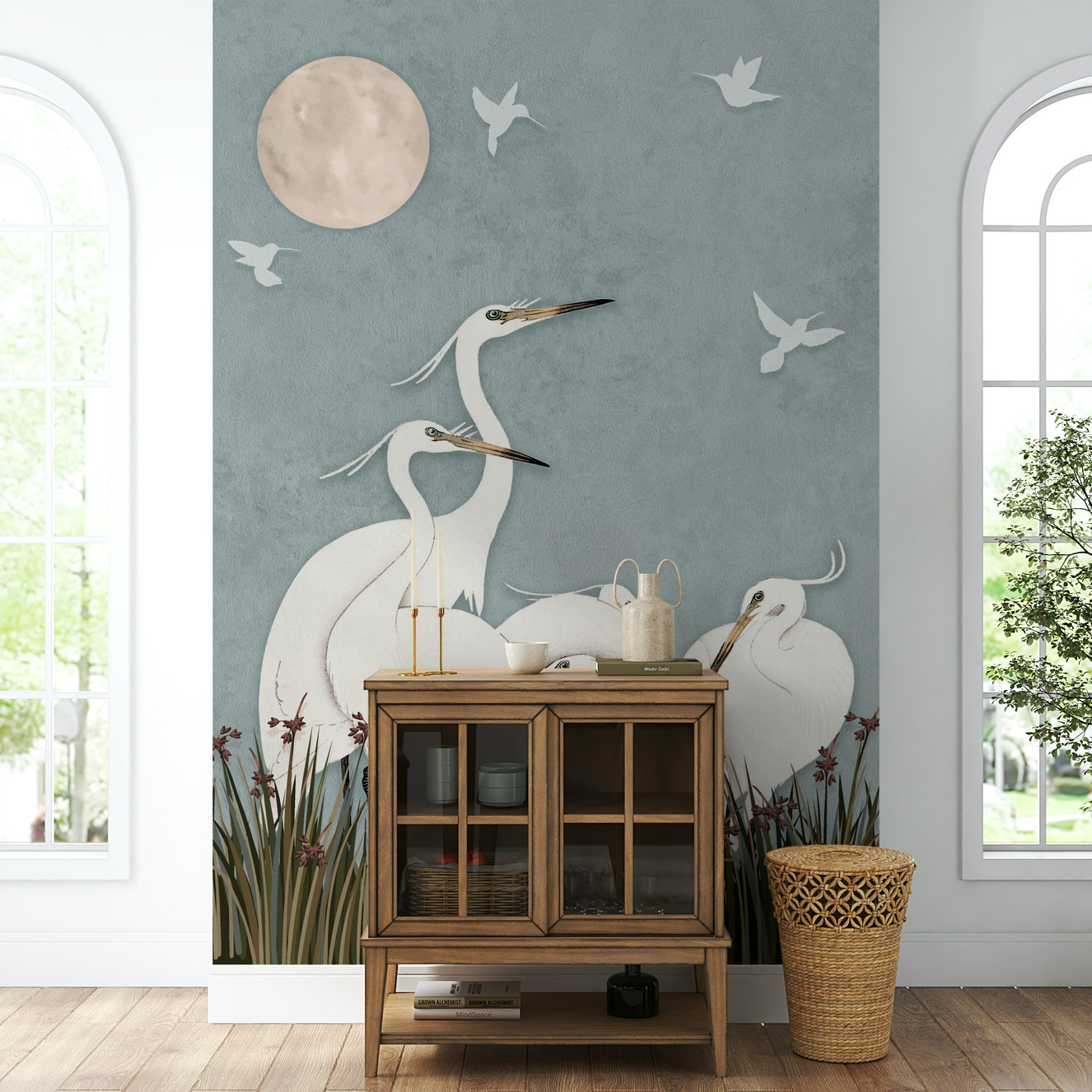 A full-wall mural of a serene night scene with egrets.
