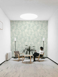 The design is a repeating pattern of large palm leaf silhouettes.
