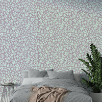 A full-wall mural showing a pattern of sketched flowers.
