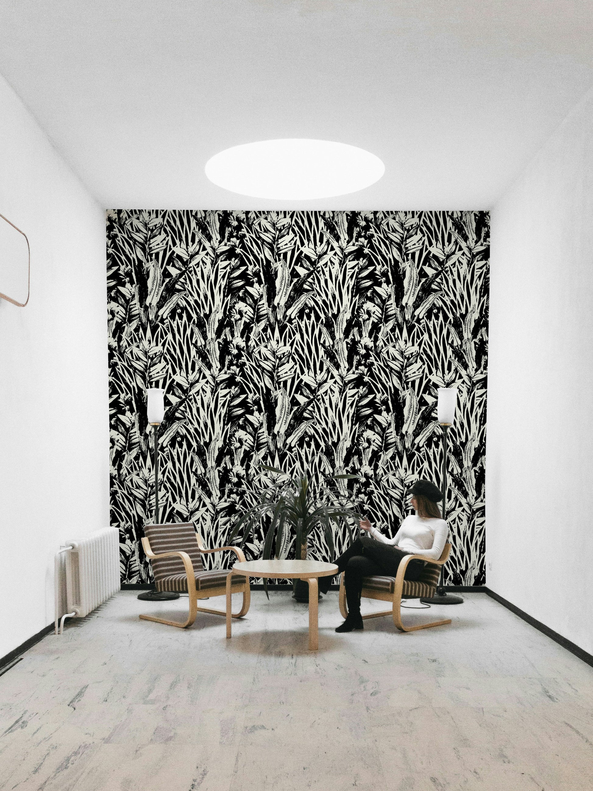 A full-wall mural showing a botanical pattern.

