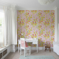 The flowers have bold, solid colors like yellow, pink, and green.
