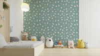 An angled shot of a wall with seashell wallpaper

