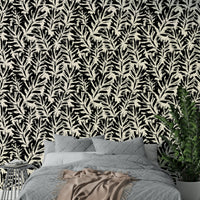 A sunroom decorated with a hand-painted leaf mural

