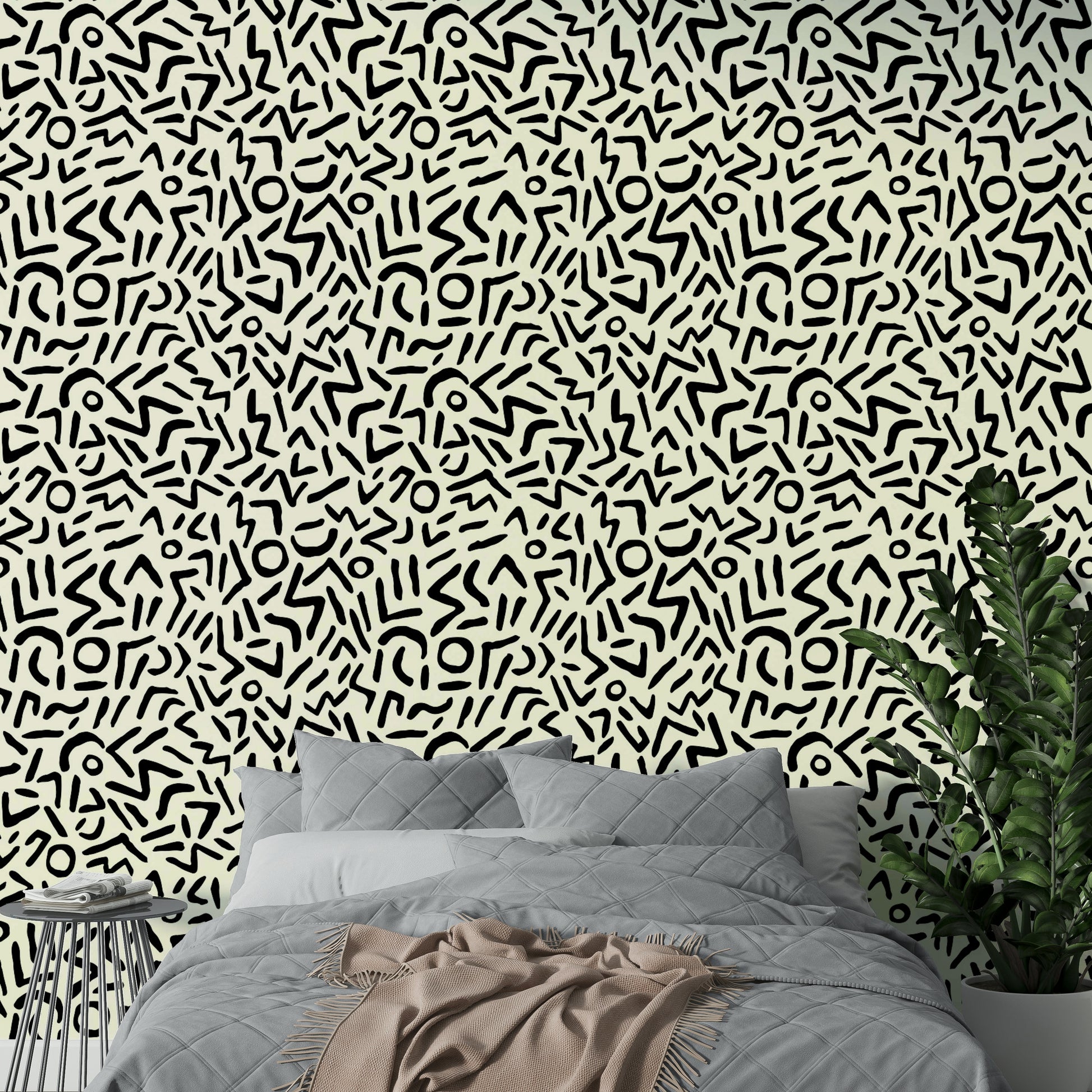 A bedroom decorated with an abstract wall mural

