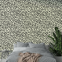 A bedroom decorated with an abstract wall mural

