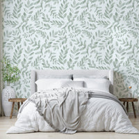 Various types of green leaves fill the spaces between the flowers.
