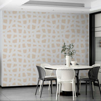 The background of the wallpaper is a warm, creamy off-white.
