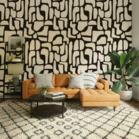 A bedroom decorated with a stone mural

