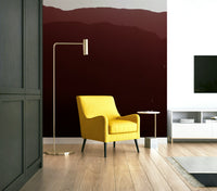 The wallpaper is used as a feature wall in a bedroom.

