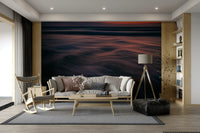 A living room with the ocean wave wall mural.

