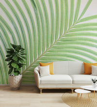 A contemporary living room with a large lime leaf wall mural.

