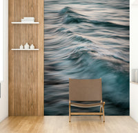 A minimalist home office with the abstract wave wallpaper.

