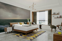 A bedroom with the artistic mural behind the headboard.

