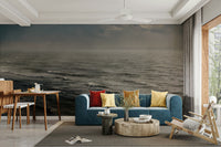 A living room with the winter surfing wall mural.

