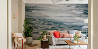 A minimalist interior with the ocean-themed wallpaper.

