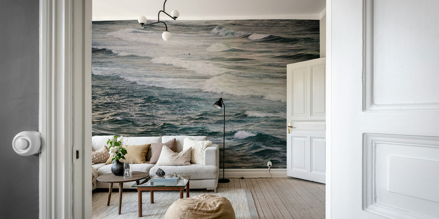 A contemporary living room with a large ocean wave wall mural.

