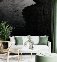 A beautiful modern living room with a dark river wall mural.

