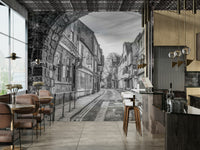 A close-up of the textured stone and quaint shops in the background.