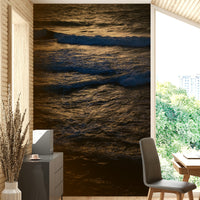 The wallpaper is used as a feature wall in a bedroom.

