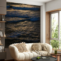 An aerial view of the waves near the shore.

