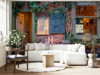 A living room featuring the cafe street wall mural.

