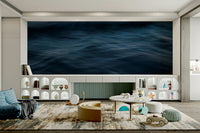 The wallpaper is used to create a feature wall in a dining room.

