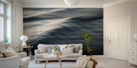 A peaceful open ocean mural on decorative wallpaper.

