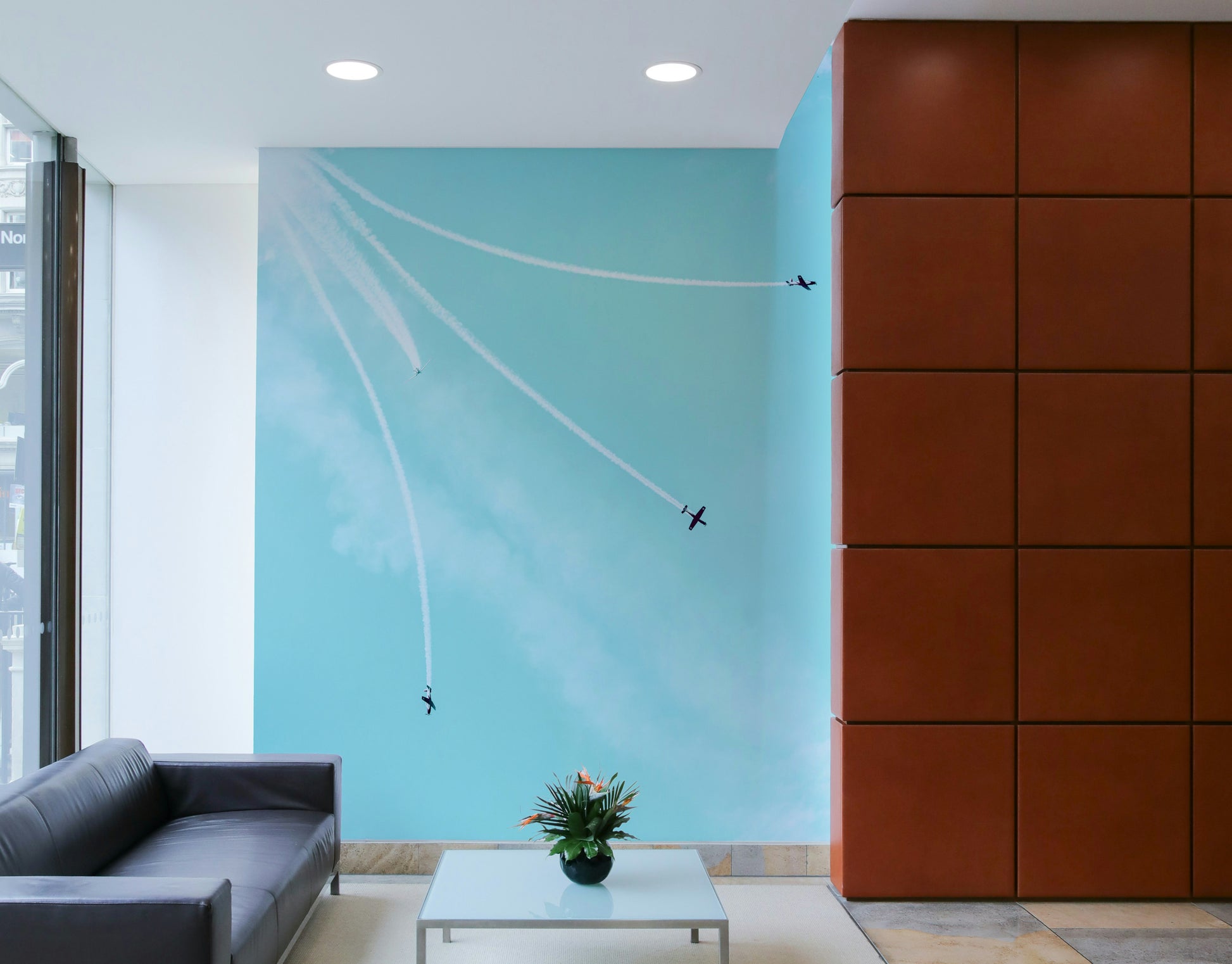 The wallpaper is used as a feature wall in a bedroom.