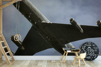 The wallpaper is used as a feature wall in a bedroom.