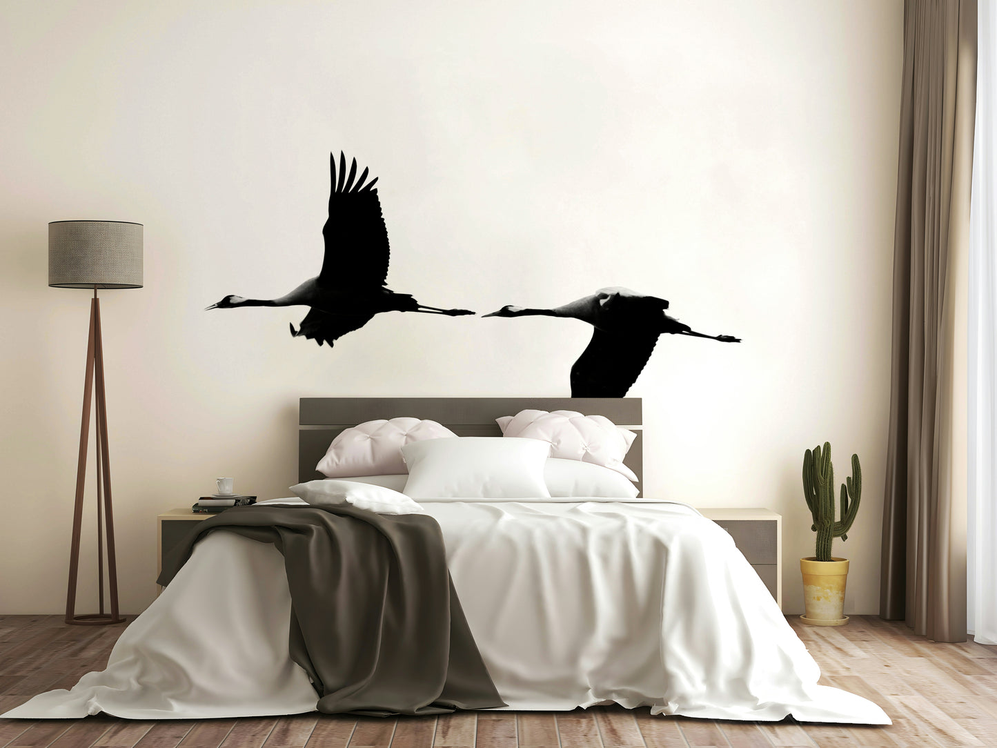 An artistic flying crane mural on minimalist wallpaper.

