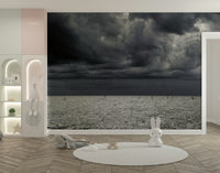 An artistic seaside view mural on minimalist wallpaper.

