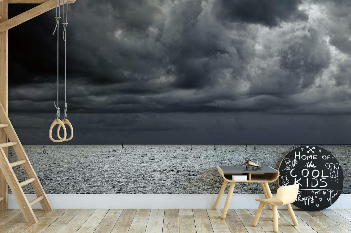 A beautiful coastal rock wallpaper mural with crashing waves.

