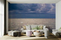 An artistic seaside view mural on minimalist wallpaper.

