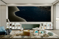 An artistic seaside view mural on minimalist wallpaper.

