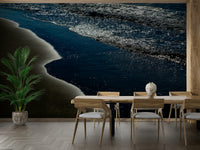 A graceful wave motion wall mural in cool, natural tones.

