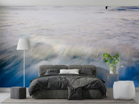 A peaceful open ocean mural on decorative wallpaper.

